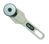 A Kai brand rotary cutter with a silver handle and a black and white circular blade.