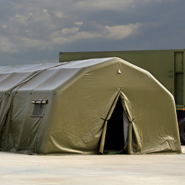 a military style tent setup on a concrete floor