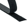 A roll of black sew-on hook and loop fasteners.