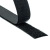 A roll of black sew on hook and loop fasteners.